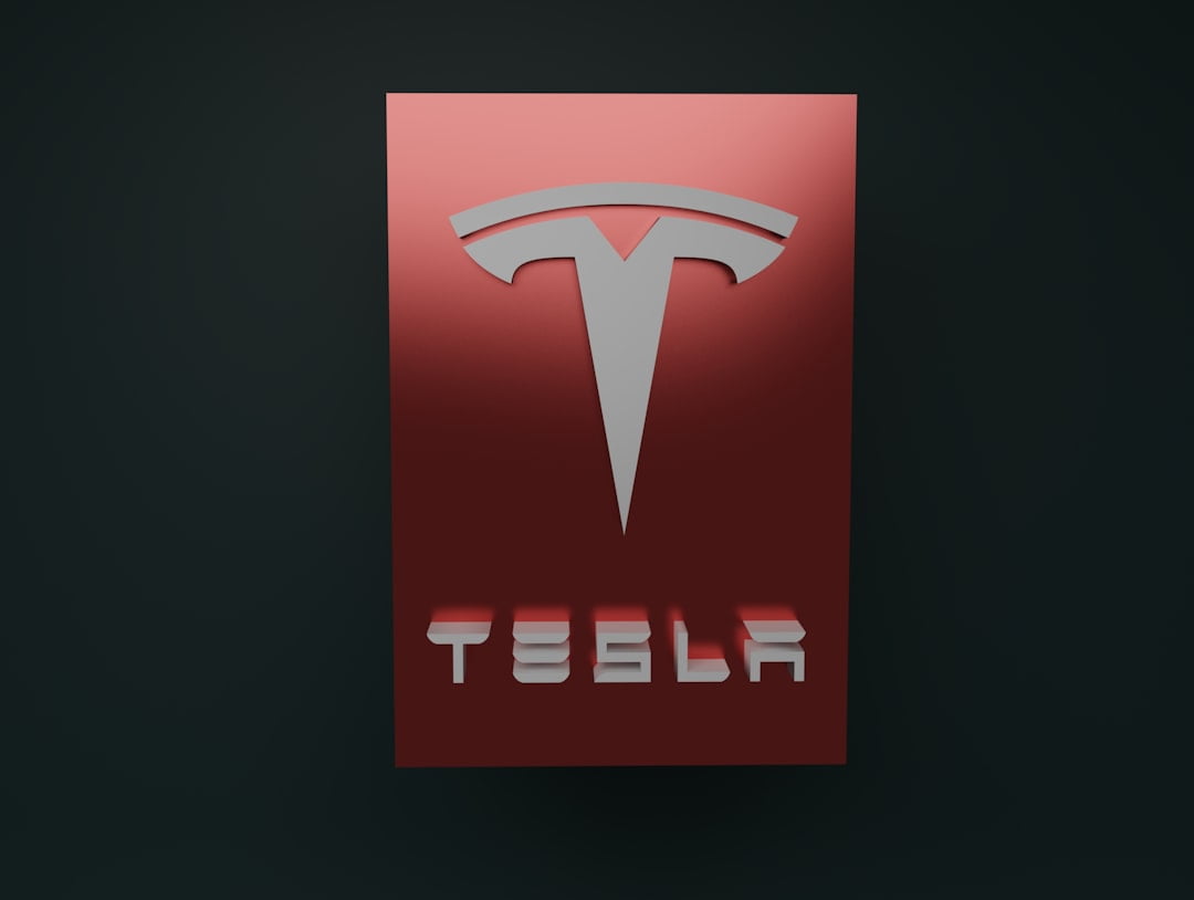 Rødt Tesla-logo på sort baggrund