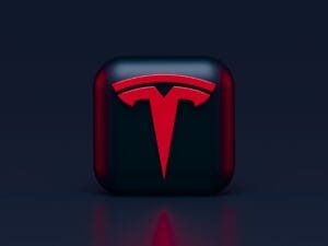 Tesla-logo i 3D med rød baggrund