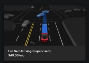Tesla-bil i selvkørende tilstand på vej gennem en bykryds.